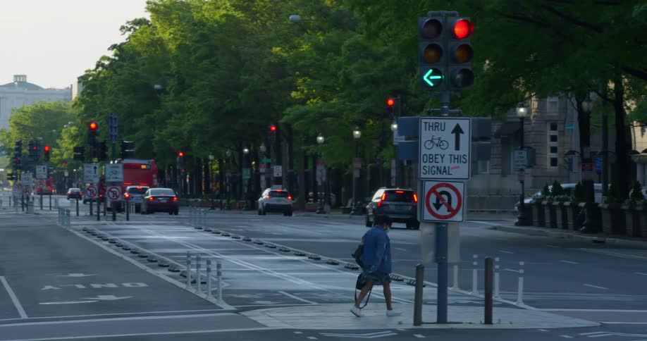 A woman crosses the road