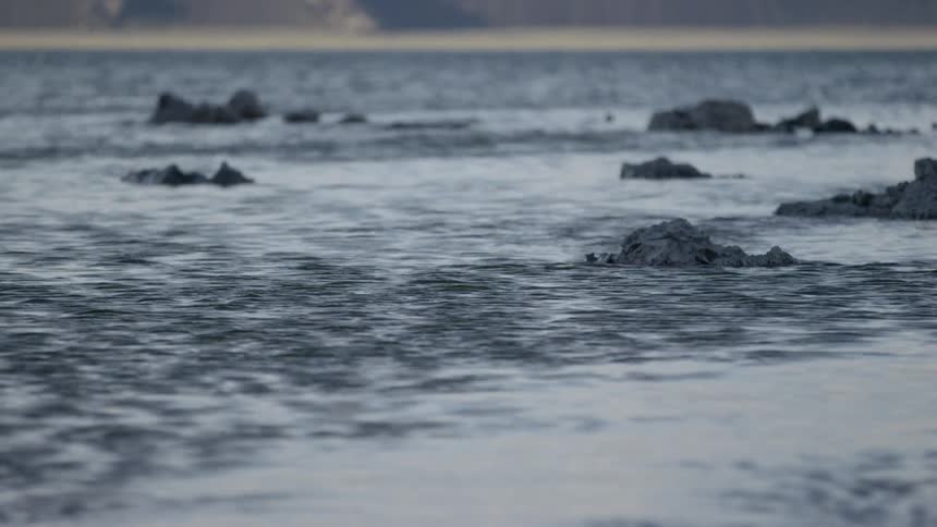 Water lapping around rocks