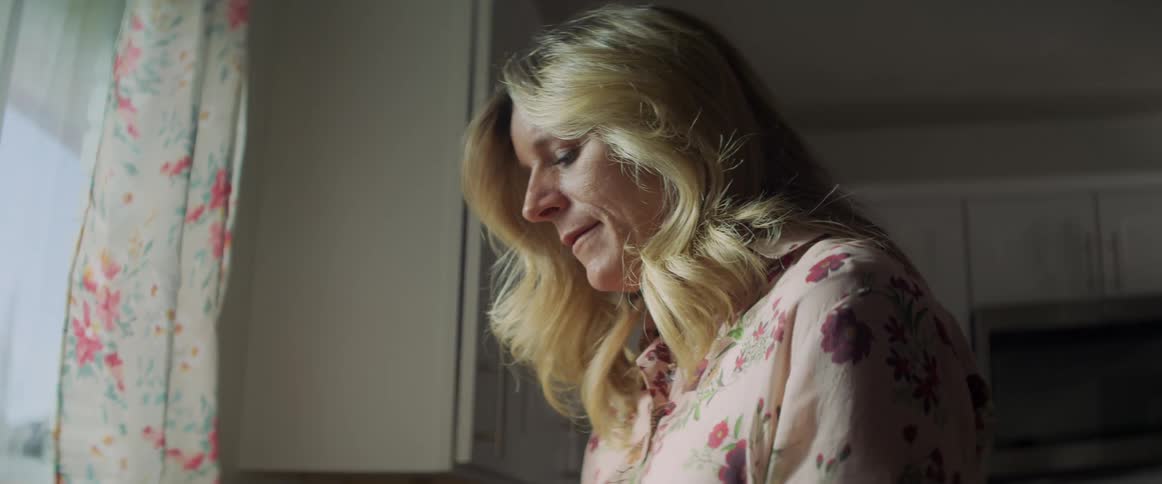 A woman is working in her home kitchen