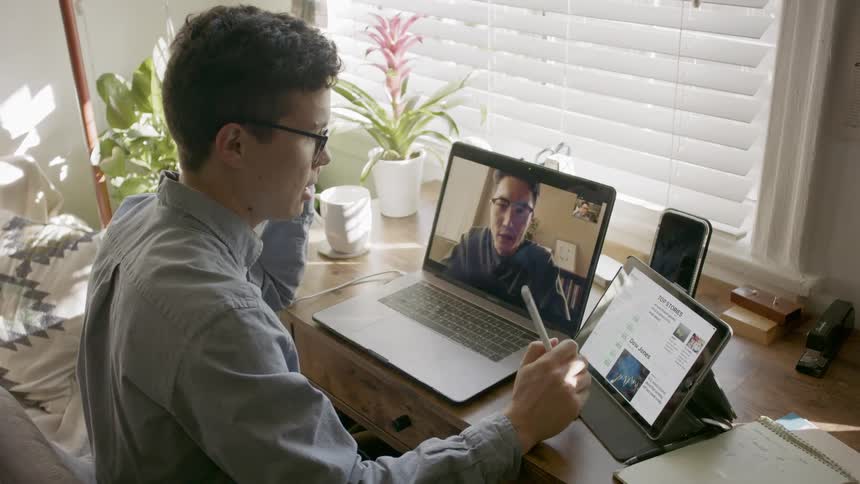 Coworkers having a zoom meeting while working from home