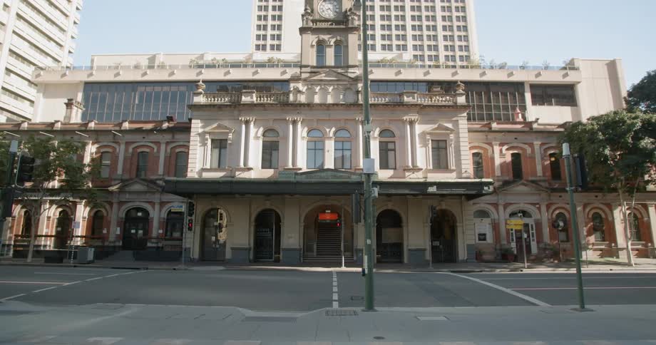A city street with traffic lights and buildings