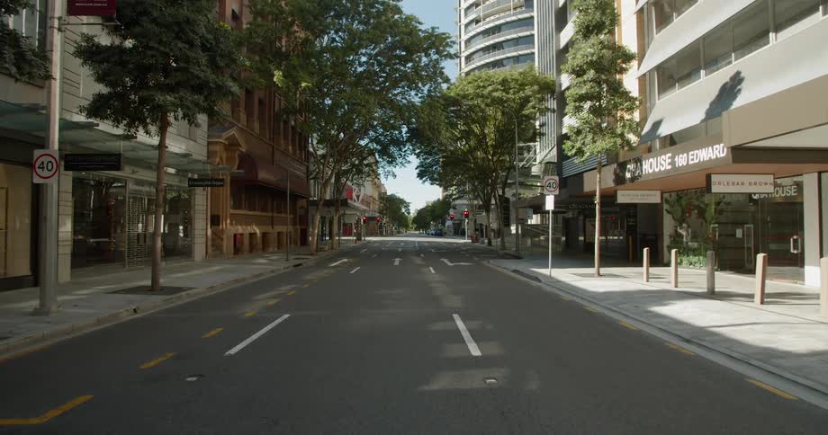 An empty city street in a metropolis on a sunny day