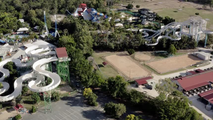 A water park with water slides and a parking lot