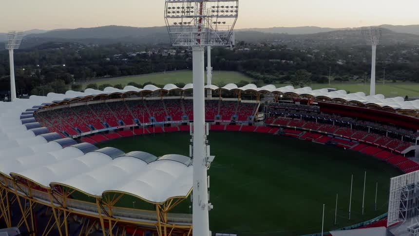 An aerial view of an empty stadium is displayed