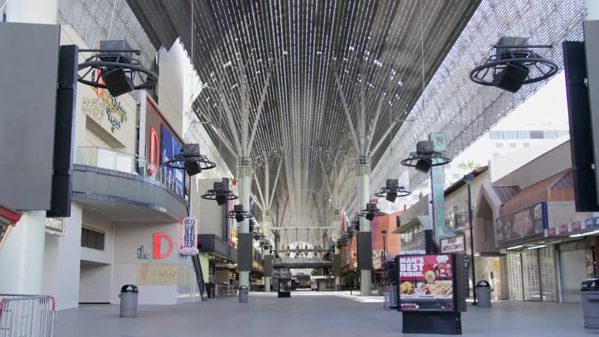 The inside of an empty mall with all the stores closed