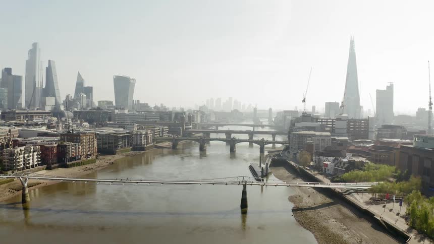 A river with bridges and buildings and skyscrapers in the background