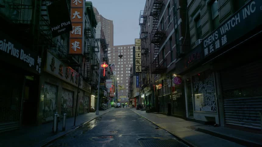 The street is dark by the shops