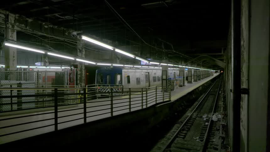 A subway stopped at an underground platform
