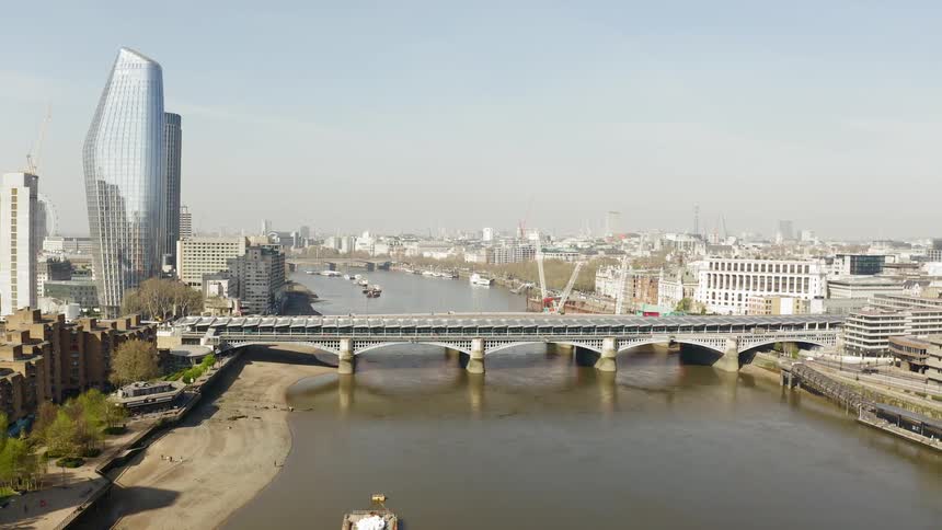 A bridge spanning a river that separates two sections of a metropolis