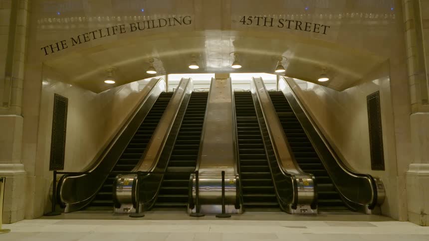 Deserted escalators moving up and down at the metlife building in new york