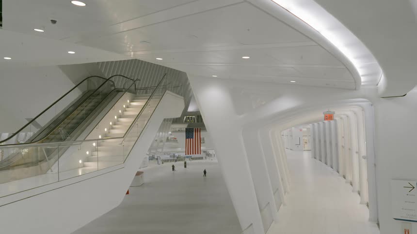 A white terminal with staircases and an american flag