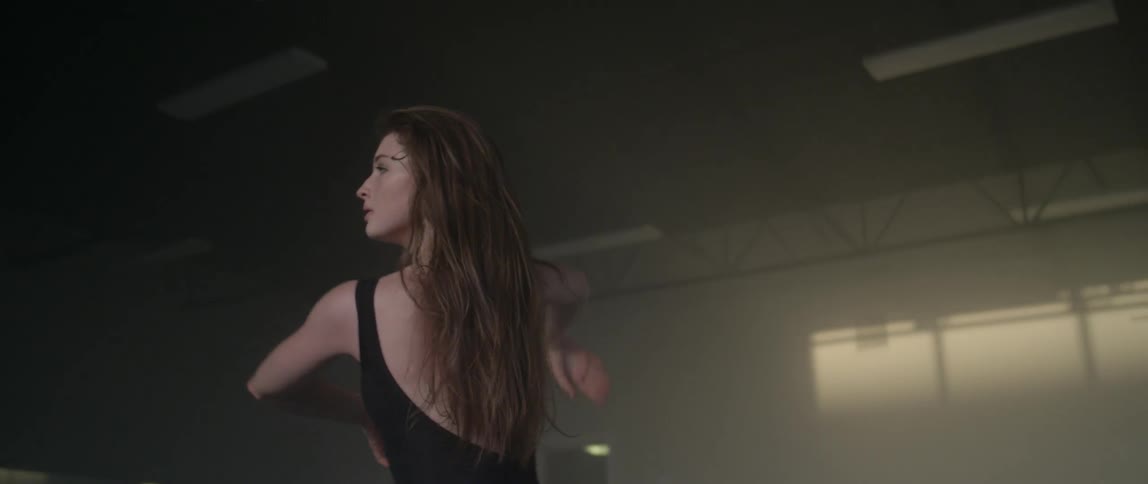 A woman dances in a studio