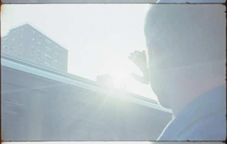 Man standing on a train platform waiting for a train to stop