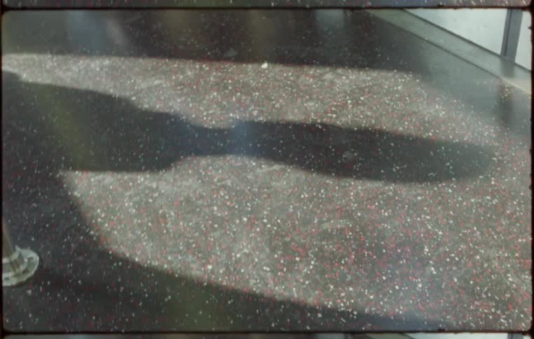 A shadow on a train floor