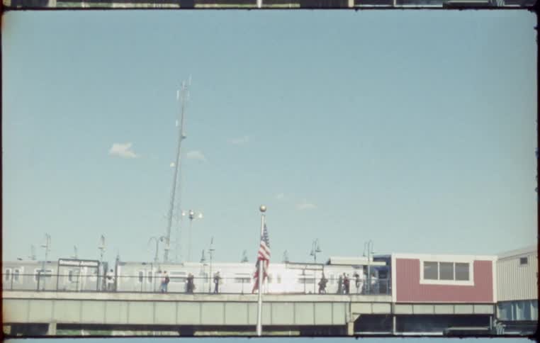 American flag in front of train station