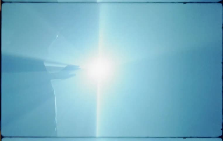A person is walking towards a flashing light