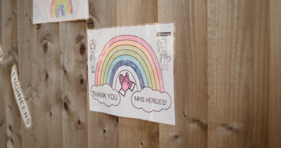 Thank you signs hanging on a fence
