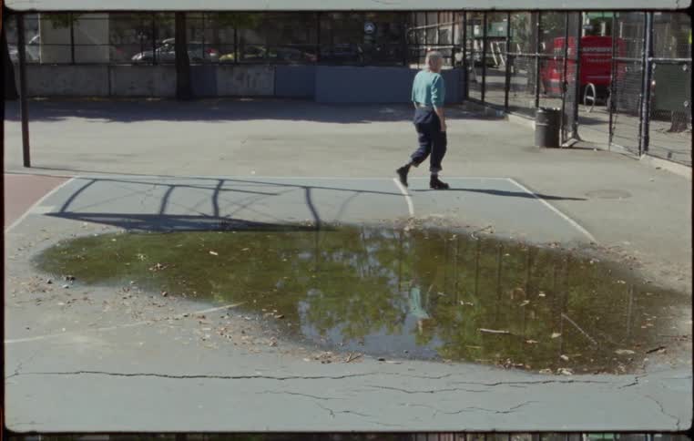 A person walks through the basketball court