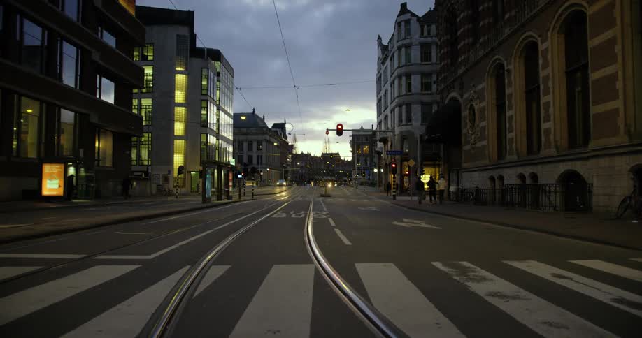The street is empty in the city at dusk