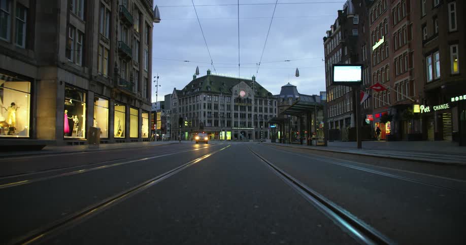 A street runs through a mostly deserted downtown area