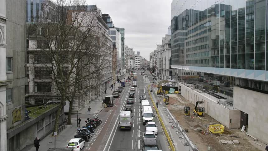 A busy road through a metropolis during the day