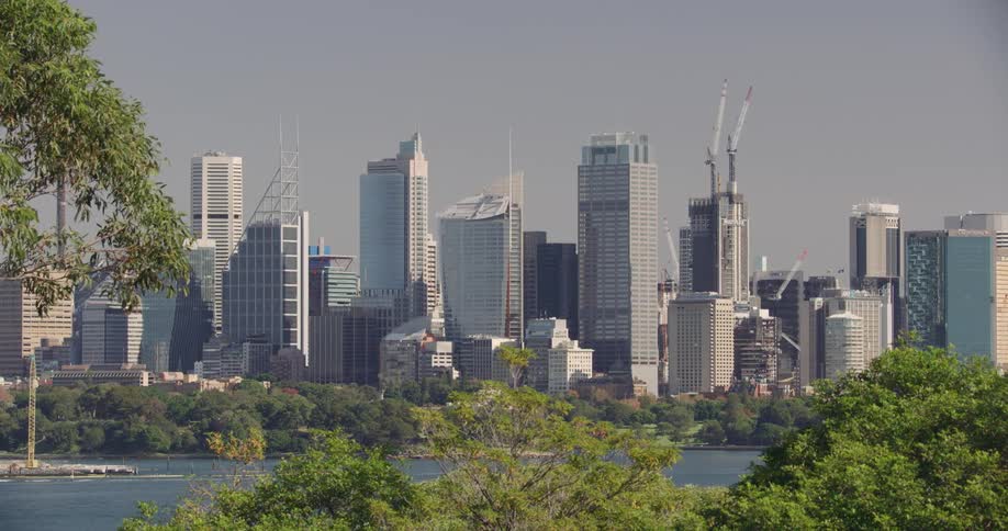 Skyline of a city with tall buildings and skyscrapers next to the sea