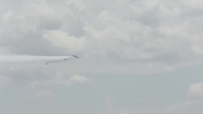 Jets fly in formation across the sky
