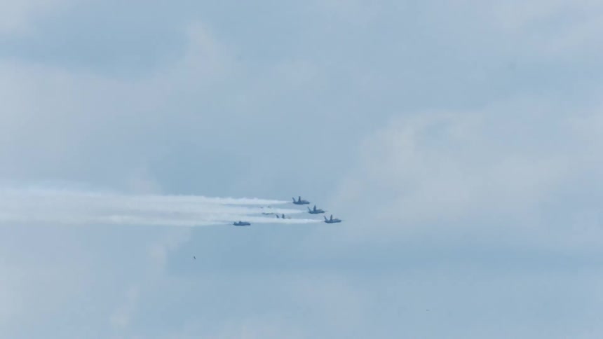 Air force thunderbirds perform aerobatic formation in the sky