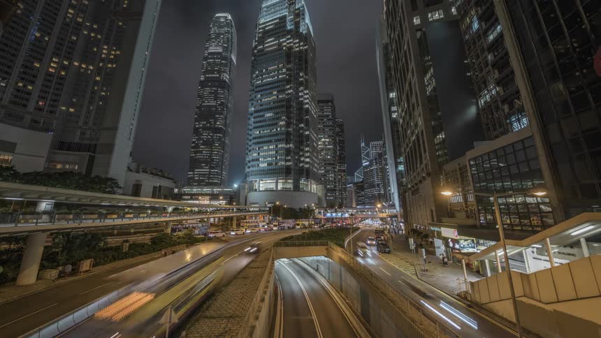 Timelapse of traffic flowing on city downtown at night