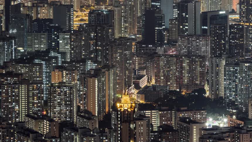 Aerial view of the illuminated tall buildings and condos at night