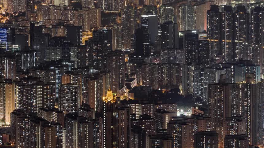 Skyline of the city with illuminated tall buildings and condos at night