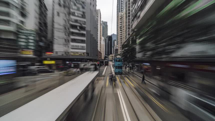 Time lapse of people and vehicles on a busy city street