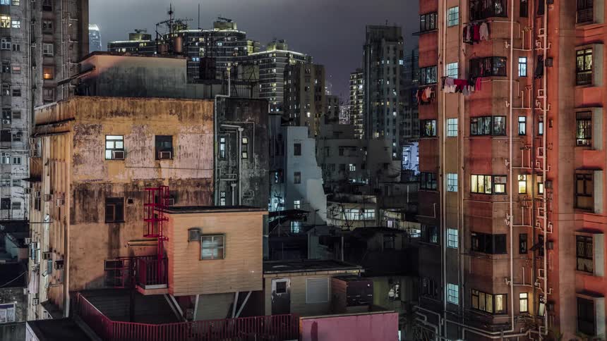Time lapse of apartment buildings in a developing nation at night