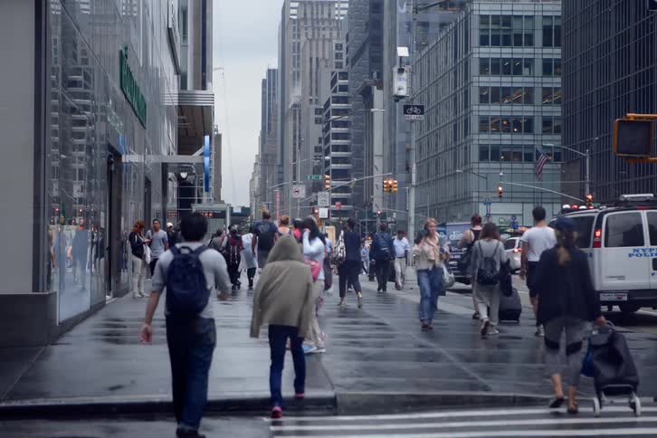 Time lapse of pedestrians and vehicles on a busy city street