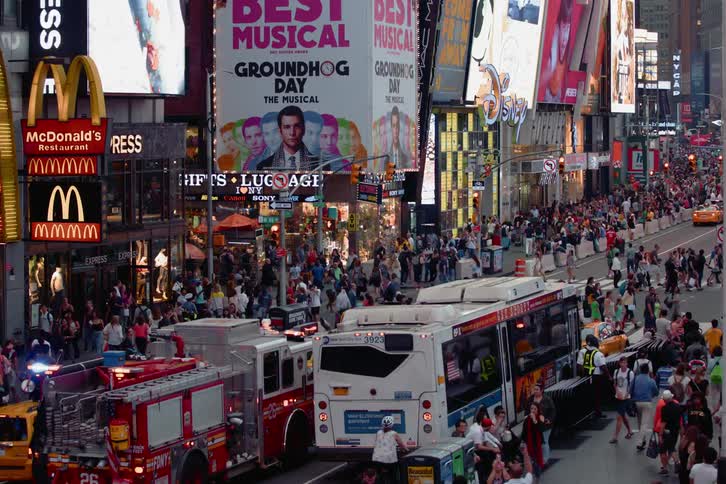 People and vehicles on a busy city street