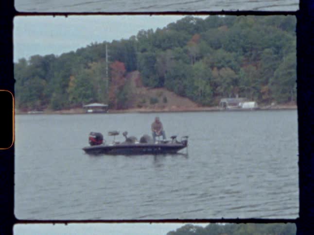 Man sitting on a boat in a river at day