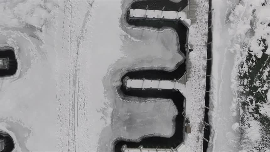 Unfrozen water surrounds piers during winter