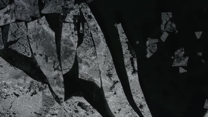 Black white and gray shapes that look like water and ice