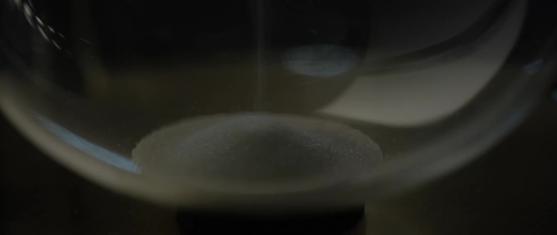 Salt falling in an hourglass