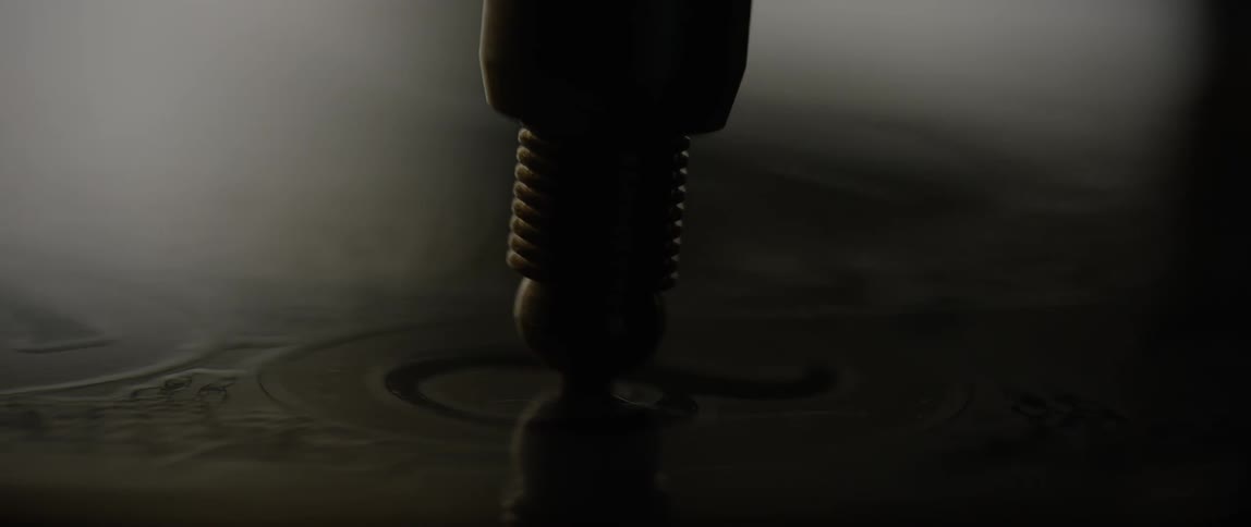 Light and shadow play across the face of watch or compass