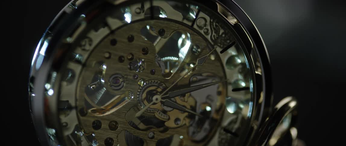 The second hand moves on an intricate pocket watch