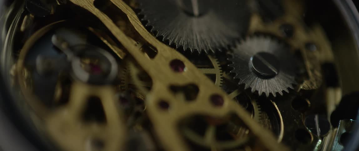 Gears turn inside open watch mechanism