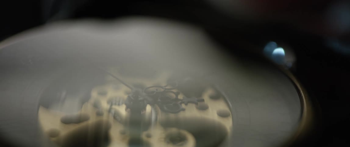 A watch with the glass reflecting light