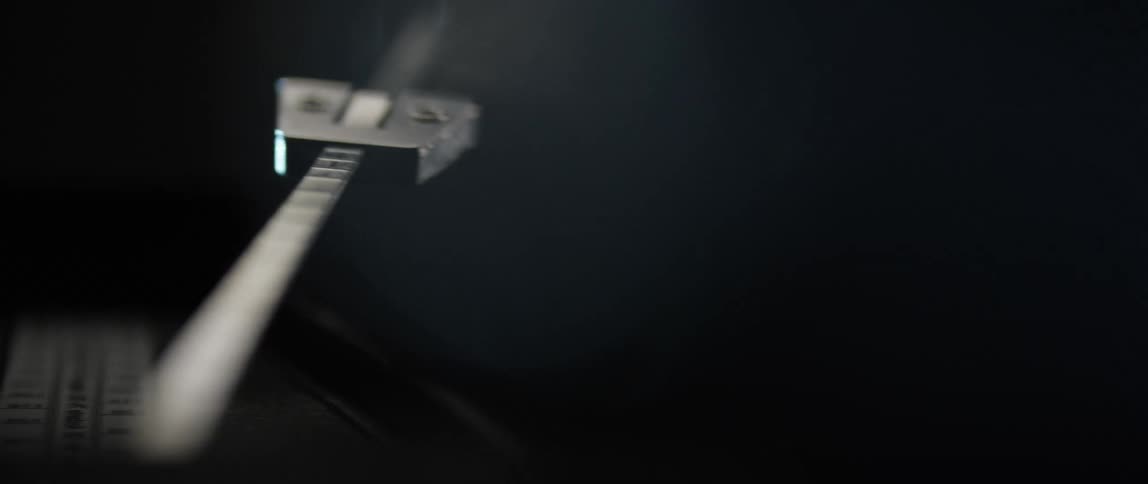 A metronome moving back and forth