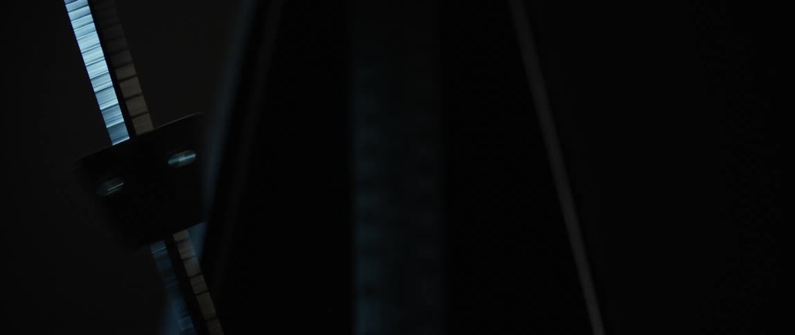 A metronome arm moving back and forth