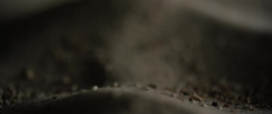 Small pieces of grain fall into a pile