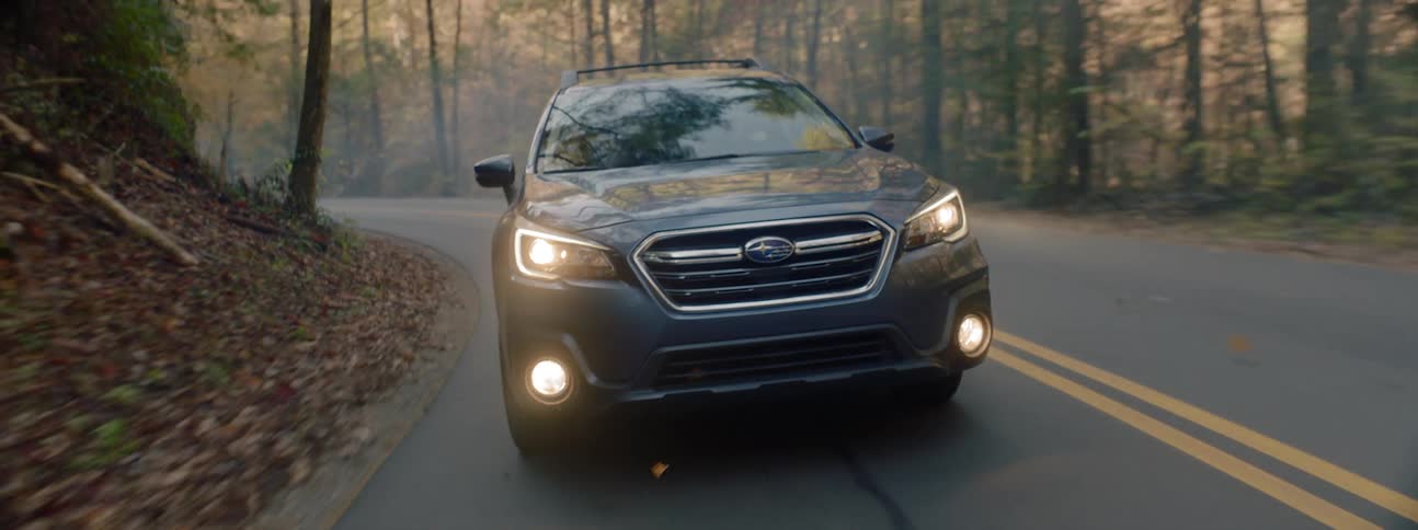 A sports utility vehicle being driven on a mountain road