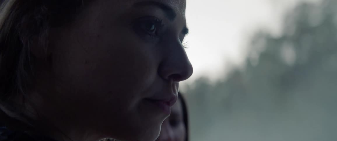 White woman crying while standing next to another woman