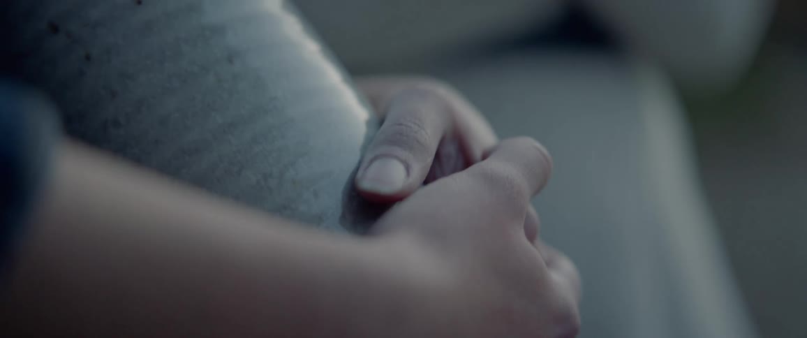 A persons hands holding a vase
