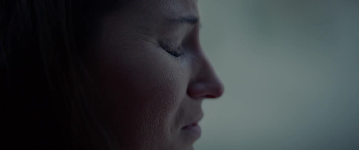 White woman crying while standing next to another woman